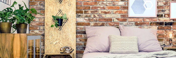 Wall Mural - Bed against brick wall