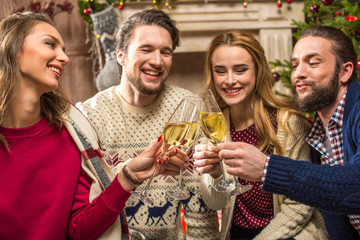 Happy people with glasses of champagne