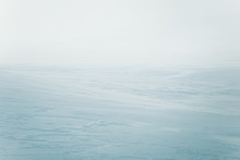 A Beautiful, Minimalist Landscape Of Flat, Snowy Norwegian Field. Clean, Light, High Key, Decorative Look.