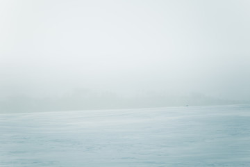 A beautiful, minimalist landscape of flat, snowy Norwegian field. Clean, light, high key, decorative look.