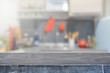© bunditinay - Stone table top and blurred kitchen interior background - can used for display or montage your products.
