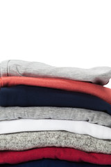 Wall Mural - Stack of clothes on white background, closeup