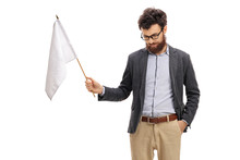 Man With His Head Down Holding A White Flag