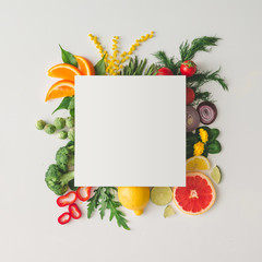 Wall Mural - Creative layout made of various fruits and vegetables with white paper card. Flat lay. Food concept.
