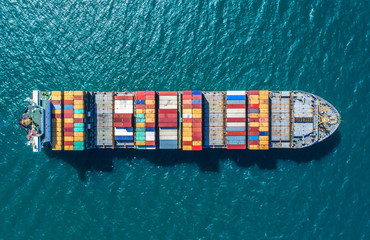 container ship in import export and business logistic.By crane ,Trade Port , Shipping.cargo to harbor.Aerial view.Water transport.International.Shell Marine.Top view.