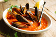 Mussel dish cooked in red marinara sauce 