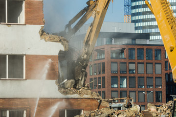 Wall Mural - Demolitions old building in center city with heavy equipment