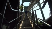 People Climbing Stairs To Reach The Top Of The Attractions 