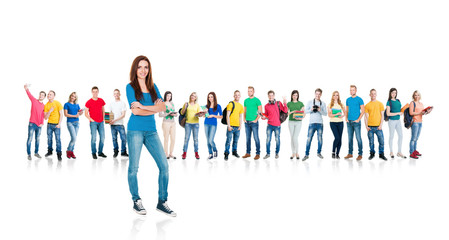 Wall Mural - Large group of teenage students isolated on white background. Many different people standing together. School, education, college, university concept.