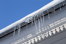 Icicle On The Wooden House