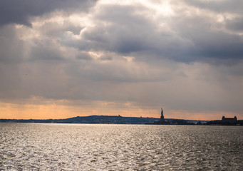 Wall Mural - Statue of Liberty silhouette and Liberty Island - New York, USA