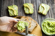 spread with a knife on a paste of avocado bread Greceanii. raw and healthy food for vegan