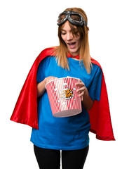 Wall Mural - Pretty superhero girl eating popcorns