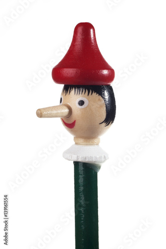 Wooden Pinocchio doll isolated on white background.