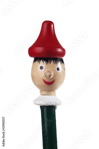 Wooden Pinocchio doll isolated on white background.
