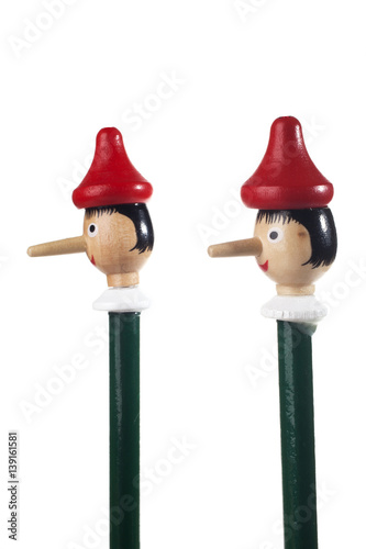 Wooden Pinocchio doll isolated on white background.