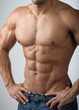 © dave - Strong Athletic Man Fitness Model Torso showing six pack abs. Bodybuilder physique in jeans.