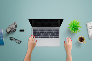 Poster - Office desk with laptop computer. Woman work on computer with blank screen for design presentation. Top view of clean tidy desk.