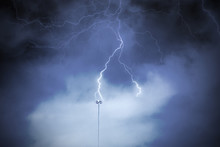 Lightning Rod Against A Cloudy Dark Sky. Natural Electric Energy.