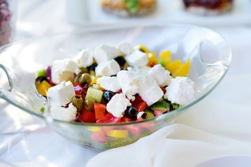 Wall Mural - Delicious vegetables and goat cheese salad served on a party or wedding reception