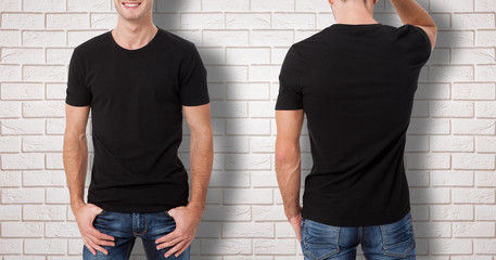 Wall Mural - Shirt design and people concept - close up of young man in blank black t-shirt isolated.