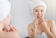 © geargodz - woman use dental floss white healthy with mirror in bathroom