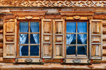 Russian ethnic vintage wooden windows, with open shutters...