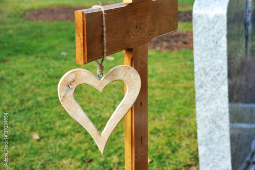 Grabkreuz Aus Holz Mit Daran Hangendem Holzherz Als Erinnerung An Grab Buy This Stock Photo And Explore Similar Images At Adobe Stock Adobe Stock