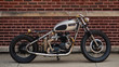 old motorcycle against brick wall