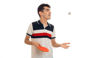 Wall Mural - young guy looking to the side and holding a tennis racket