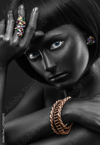 Naklejka na kafelki Fashion portrait of a dark-skinned girl with jewerly. Black Beauty face.