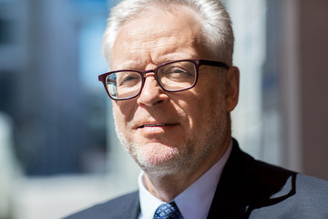 Poster - close up of senior businessman in eyeglasses