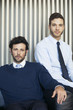 © PhotoAlto - Portrait of businessmen sitting indoors