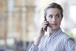 © PhotoAlto - Businesswoman using cell phone