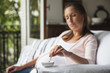 © PhotoAlto - Pregnant woman battling nicotine addiction