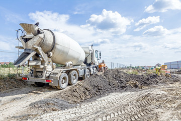 Back side view on concrete mixer, ready for pouring into transporter