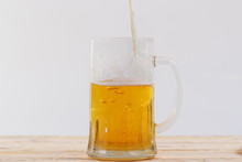 A Glass Of Beer On A White Background.