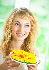 Woman with fegetarian salad at home