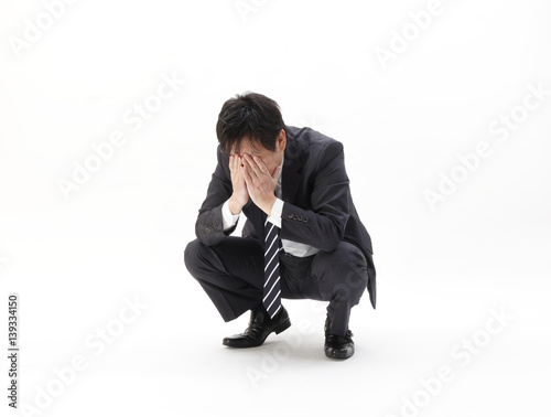 しゃがみ込むビジネスマン Stock Photo Adobe Stock