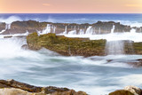 Fototapeta Tęcza - Tidal water in motion over rocks at Storms River mouth in Eastern Cape, South Africa