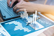 © paulfourk - business statistics success concept : businessman analytics financial chart and graph
