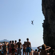 man jumps from a rock