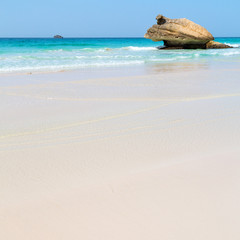 in oman arabic sea  the  hill near sandy beach sky and mountain