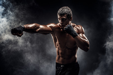 Wall Mural - Muscular topless fighter in boxing gloves