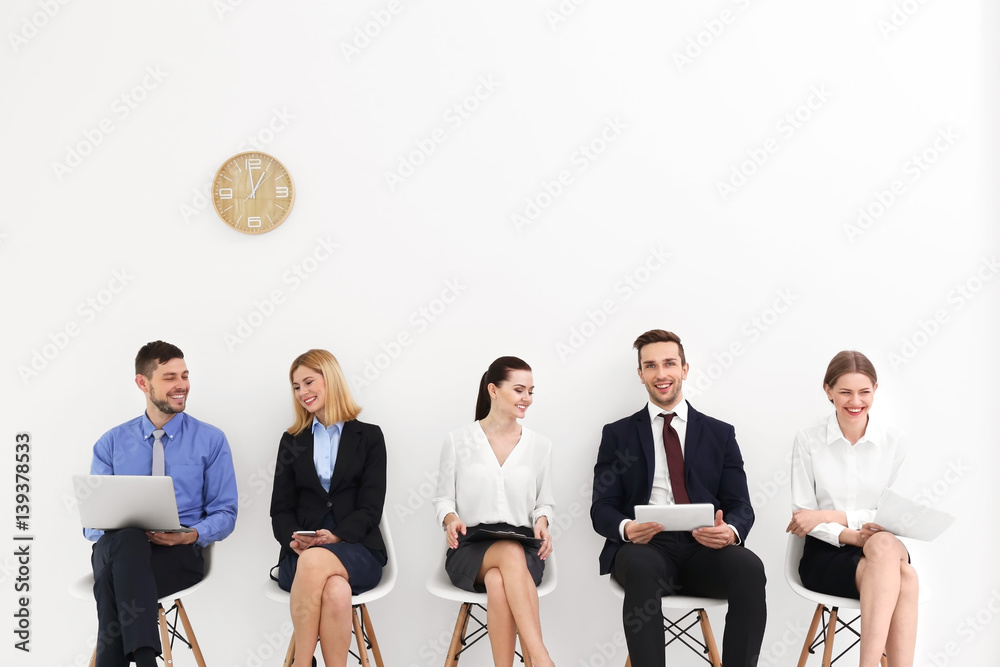 Group of people waiting for job interview on white background