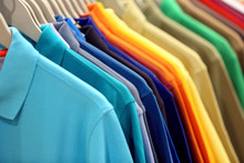 Row Of Men's Polo Shirts In Wardrobe Or Store