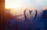 valentines day card, love and kindness concept, heart painted on frozen glass window