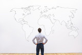 Fototapeta  - businessman looking at the world map, international career opportunity concept, business background