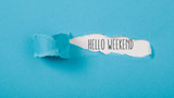 Fototapeta  - Hello Weekend message on Paper torn ripped opening