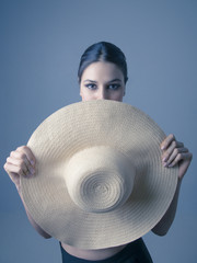 Wall Mural - Woman model posing with hat